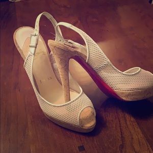 Beautiful white Christian Louboutin sandals.